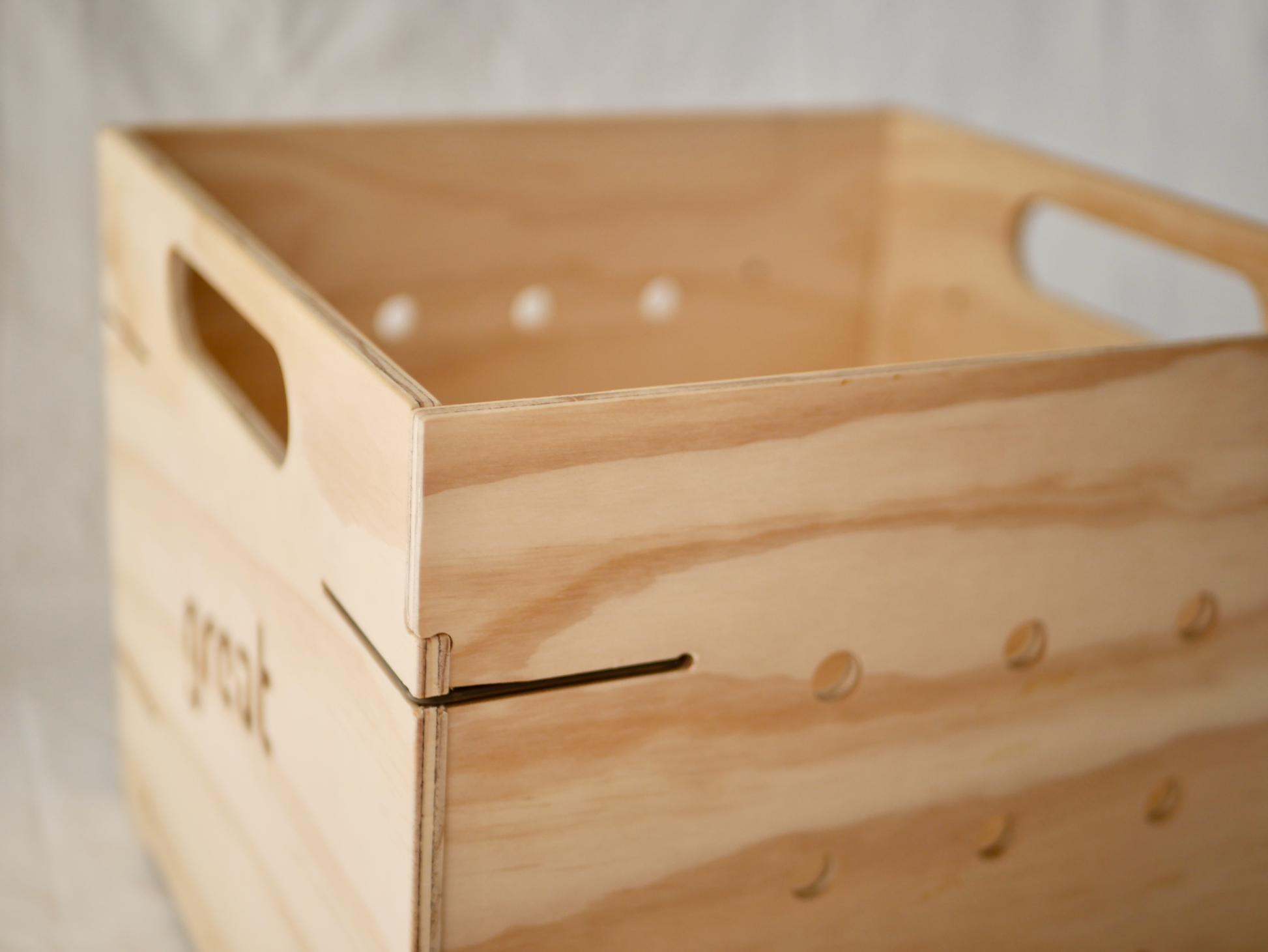 NZ-made vinyl storage box from plywood, beeswax, and steel, featuring corner holes for dust control.